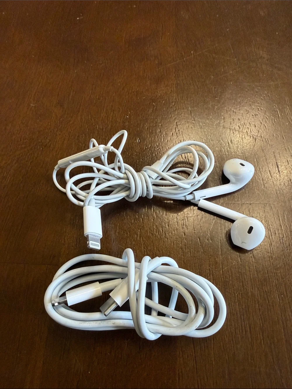 Apple lightening charger and headset.